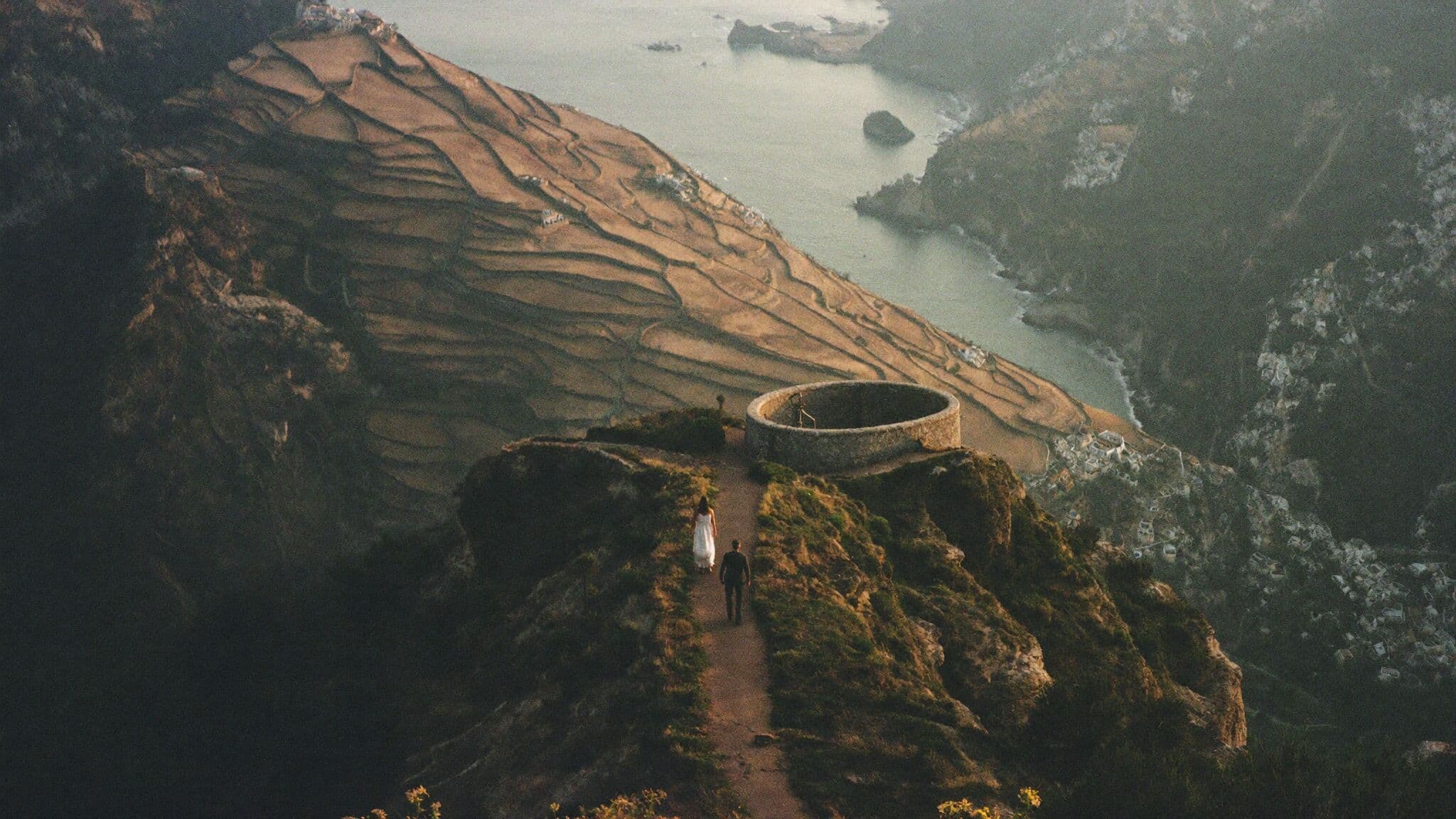 Bride and groom on the Path of the Gods trail above the sea, Amalfi Coast elopement