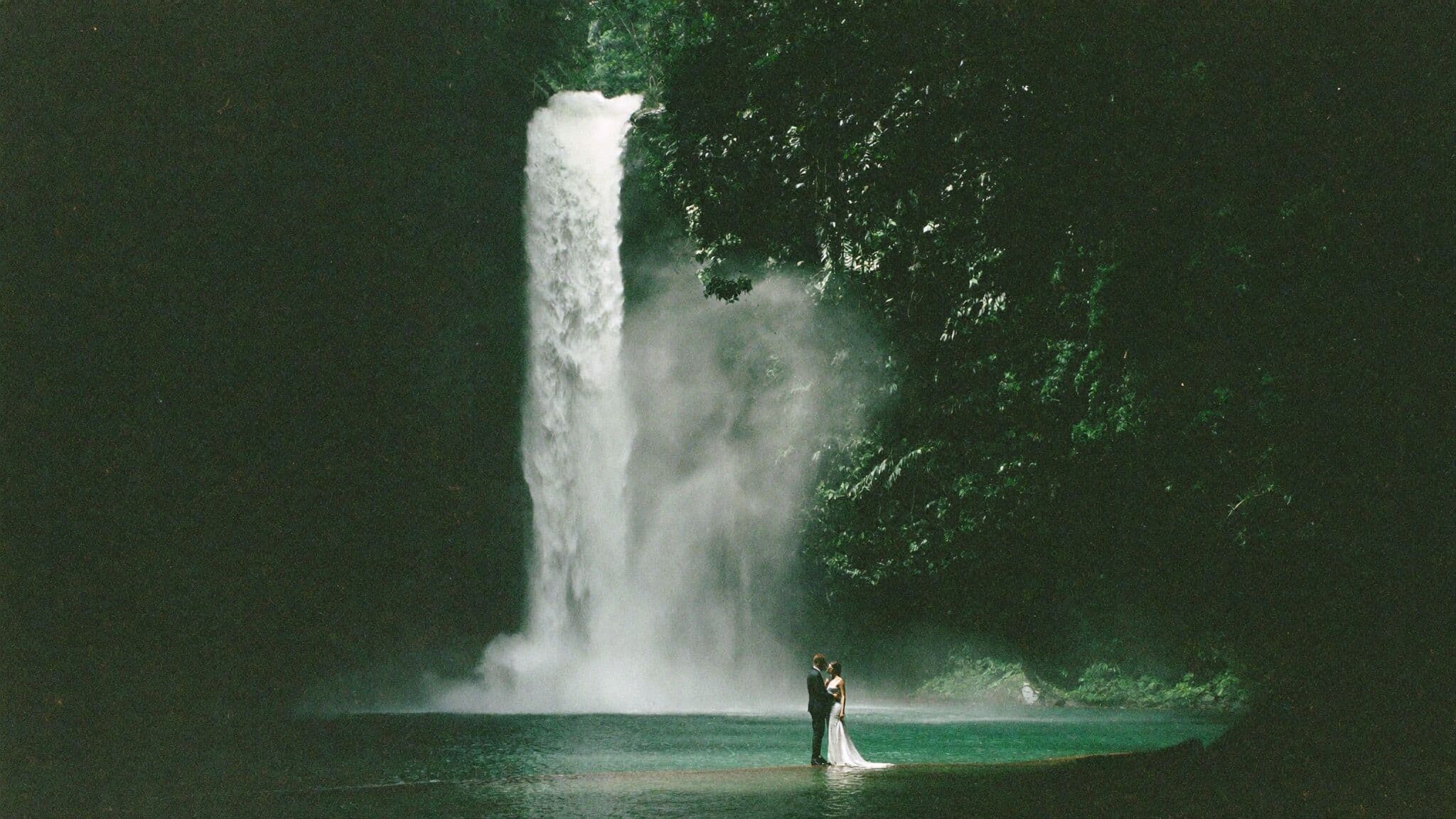 Ceremony at the base of La Fortuna waterfall during a Costa Rica elopement