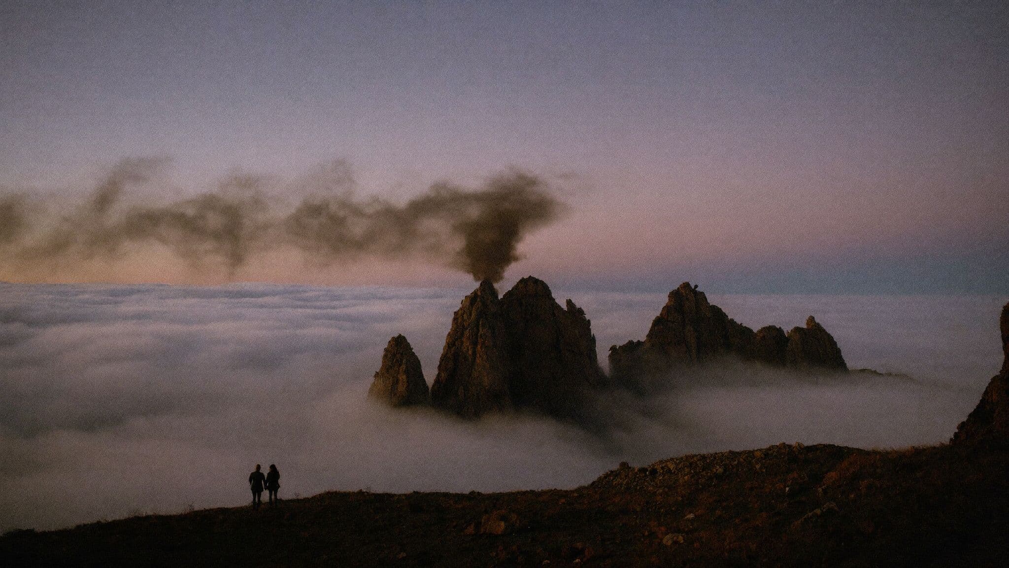 Couple above a sea of clouds at Pico do Arieiro at sunrise, Madeira elopement